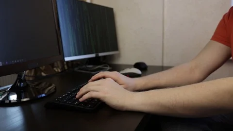 IT Programmer works at the computer typing code Stock Footage 121473110