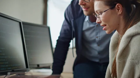 It programmers discussing project in office closeup. Hands typing computer code Stock Footage 242981049