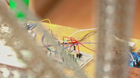 IT programming project tech person working with electronic components on a 動画素材 326034565