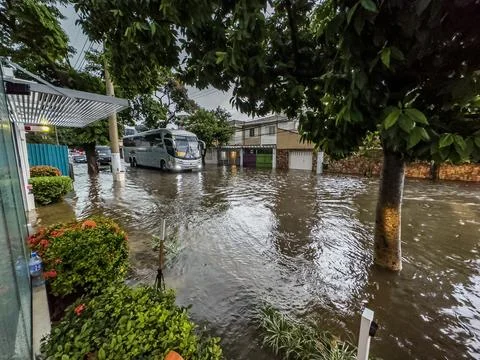 It rained heavily, causing flooding in the streets. Stock Photos