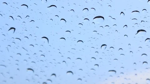 It rains on the windshield during the day in the school lawn Stock-Footage 174026461