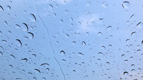 It rains on the windshield during the day in the school lawn Stock-Footage 174026468