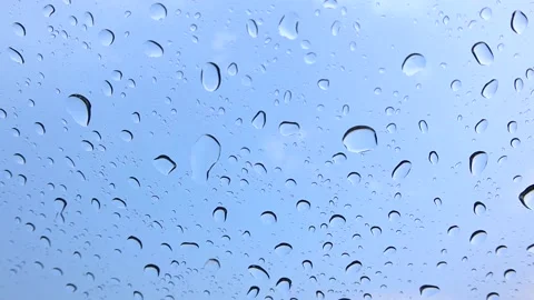 It rains on the windshield during the day in the school lawn Stock Footage 174026469