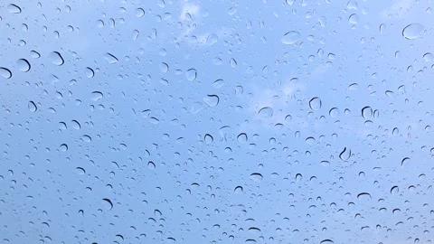 It rains on the windshield during the day in the school lawn Stock-Footage 174026477