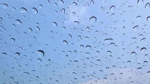 It rains on the windshield during the day in the school lawn Stock-Footage 174026478