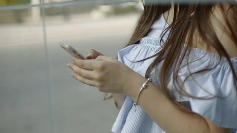 It is reflection of young female dialing number on cellphone. Stock Footage 104313166