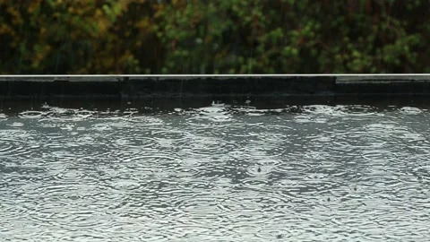 It s raining on a black flat roof Stock Footage 154482072