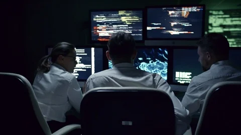 IT Security Professionals Working at Night Stock Footage