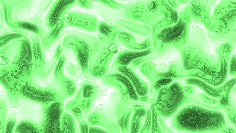 It shows a green abstract image with bubbles and a flowing effect. Stock Footage 310047596
