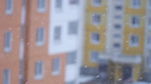 It is snowing on the background of high-rise buildings Stock Footage 101715018