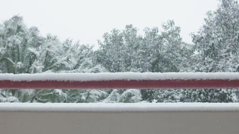 It is snowing on balcony's wall and railing Stock Footage 149298616