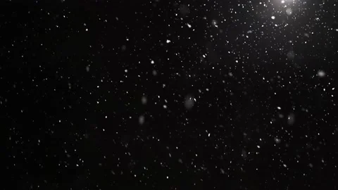 It is snowing in cold winter Real snow falls on black background 4K Stock Footage 166144971