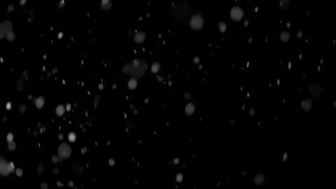 It is snowing in different directions in black background snow video overlay Stock Footage 258379967