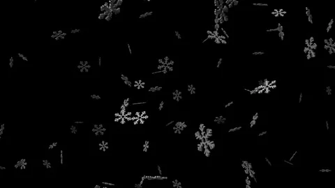 It is snowing from huge 3D snowflakes Stock Footage 287627397