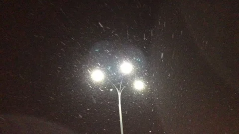 It is snowing at night. lantern shines at night Stock-Footage 103463323