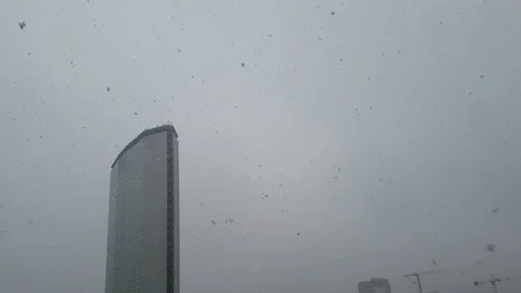 It snows in milan - view of a skyscraper with snow Stock Footage 121369064
