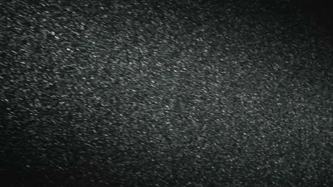 It snows at night in a ray of light. Stock Footage 148435672