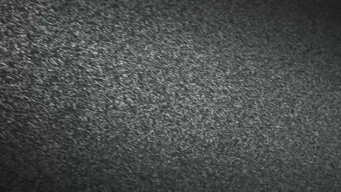 It snows at night in a ray of light. Stock Footage 148436076