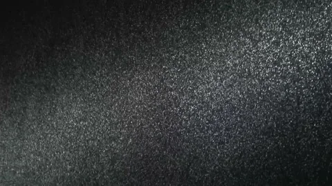 It snows at night in a ray of light. Stock Footage 148436150