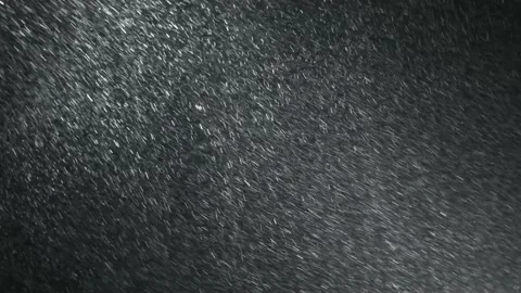 It snows at night in a ray of light. Stock Footage 148780823