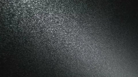 It snows at night in a ray of light. Stock Footage 148781364