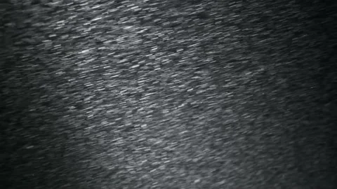 It snows at night in a ray of light. Stock Footage 148781428