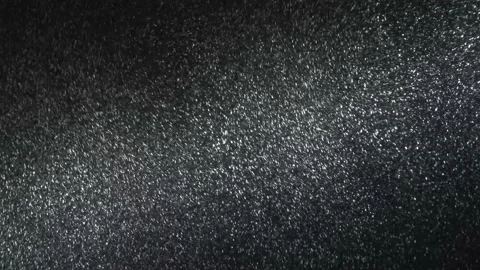 It snows at night in a ray of light. Stock Footage 149081300