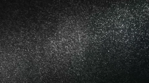 It snows at night in a ray of light. Stock Footage 149385068