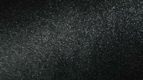 It snows at night in a ray of light. Stock Footage 156955925