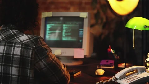 IT specialist from 90s working with software code on retro computer in office Stock-Footage 321084587