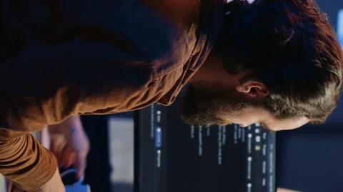 IT specialist brainstorming ways of solving database errors, working hard Stock Footage 265107826