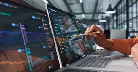IT Specialist Carefully Monitors Server Performance Using Laptop And Analytic Stock Photos