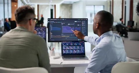 IT Specialist Carefully Monitors Server Performance Using Real-time Analytics Stock Photos