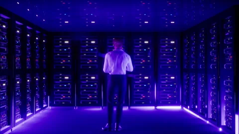 IT Specialist in Data Center. Big Server Farm Cloud Computing Facility with Male Stock Footage 246148036