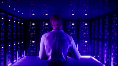 IT Specialist in Data Center. Big Server Farm Cloud Computing Facility with Male Video stock 248257948
