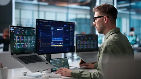 IT Specialist Monitors Real-time Network Performance Stock Footage 339889003