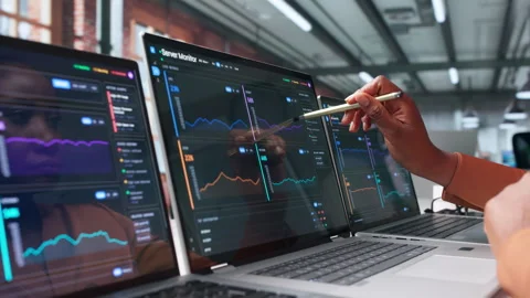 IT Specialist Monitors Server Performance Using Advanced Tools Video stock 345314254