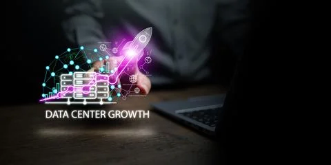 IT specialist or developer working on laptop, pointing at digital network o.. Stock Photos