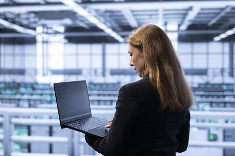 IT specialist planning and executing high tech server hub facility upgrades Stock Photos