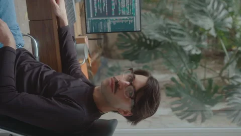 IT Specialist Posing on Camera at Workplace with Computer Video stock 252754539