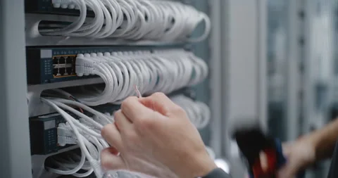 IT Specialist Preparing Twisted Pair Conductors for RJ45 Cable Termination Stock Footage 344968557