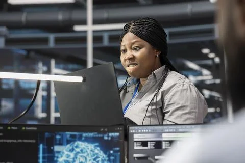 IT specialist raging, finding errors while inspecting neural network data center Stock Photos