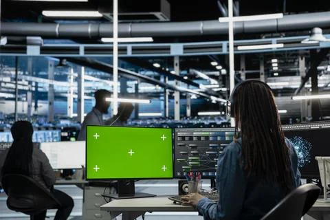 IT specialist in server hub using mockup PC to fix errors slowing down hardware 库存照片