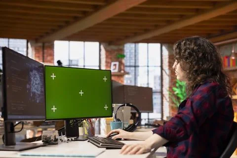 IT specialist using chroma key computer in artificial intelligence startup Stock Photos