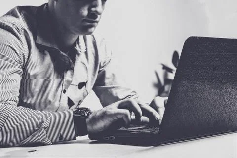 It specialist using laptop. Network security system and internet data securit Stock Photos