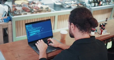 IT specialist at work. A male programmer involved in software development or Stock-Footage 271071410