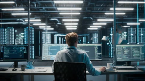 IT Specialist Working on Computer in Data Center Stock Footage 167229025