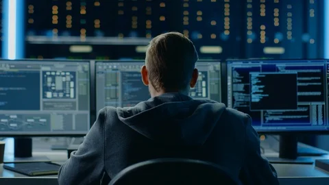 IT Specialist Working on Personal Computer with Monitors Showing Coding Language Stock Footage 103512855