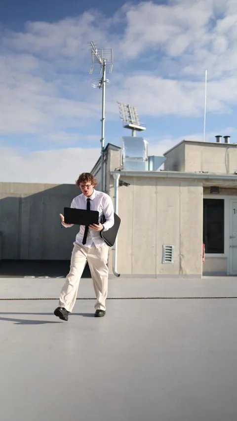 IT specialist works on laptop while walking but dislikes his project Stock Footage 345992822