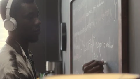 IT Specialist Writing Computer Algorithm on Chalkboard Video stock 263734291